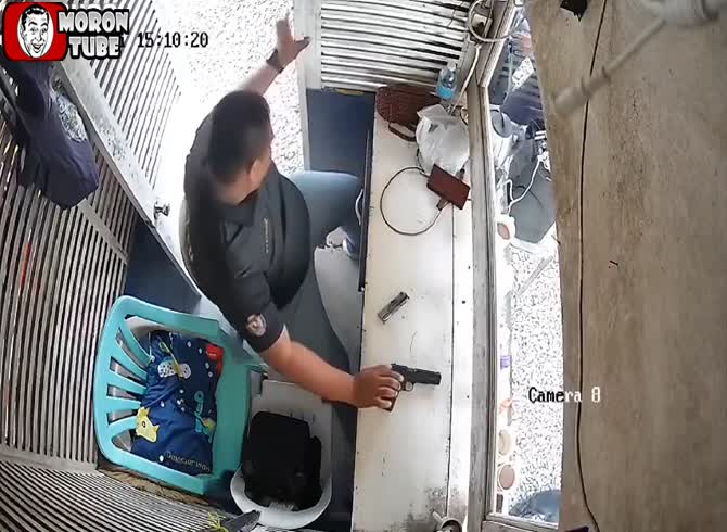 Video :After playing with a pistol for a few minutes, he shoots his own foot